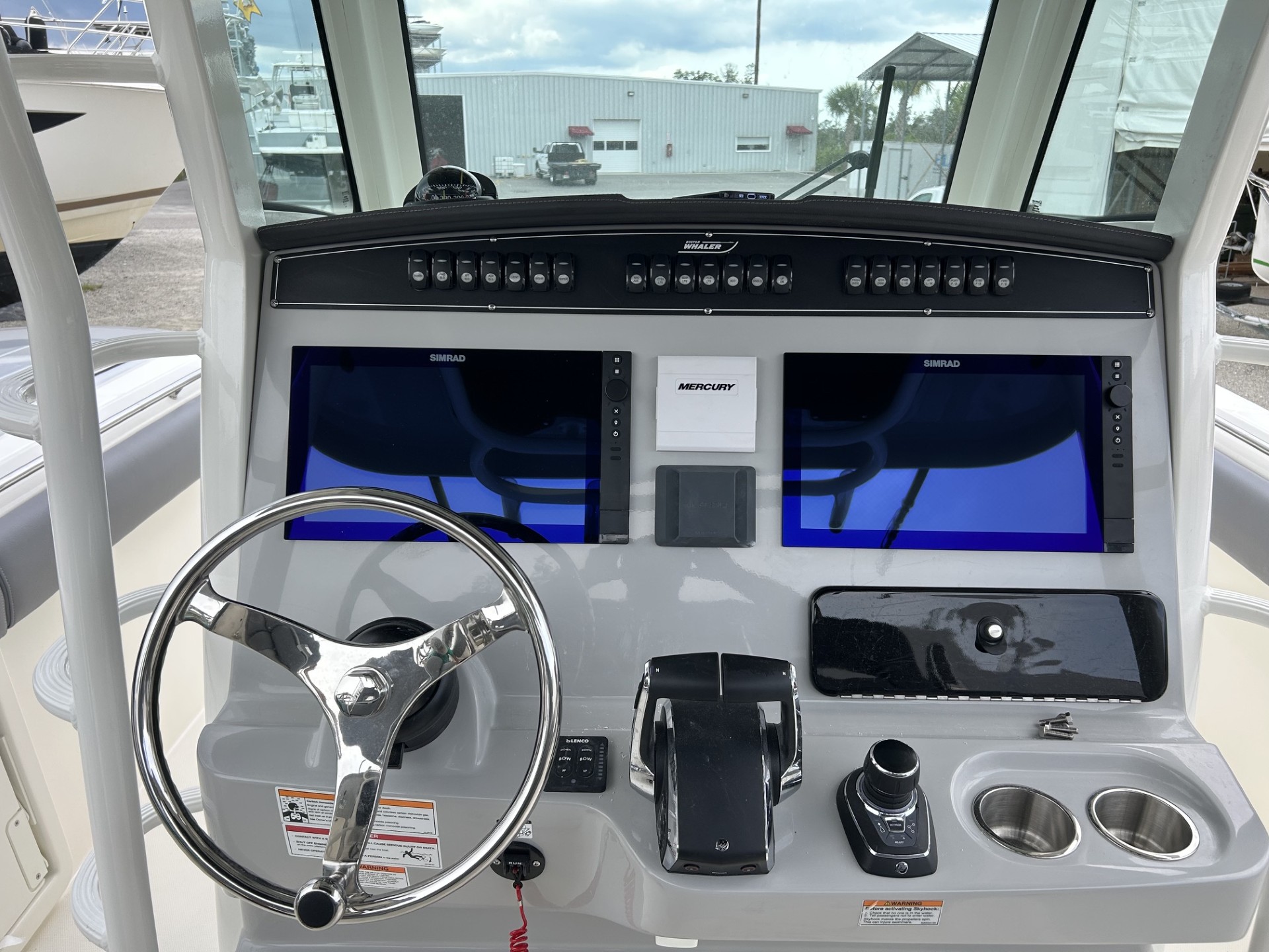 Dual Simrad multifunction displays integrated into a marine helm